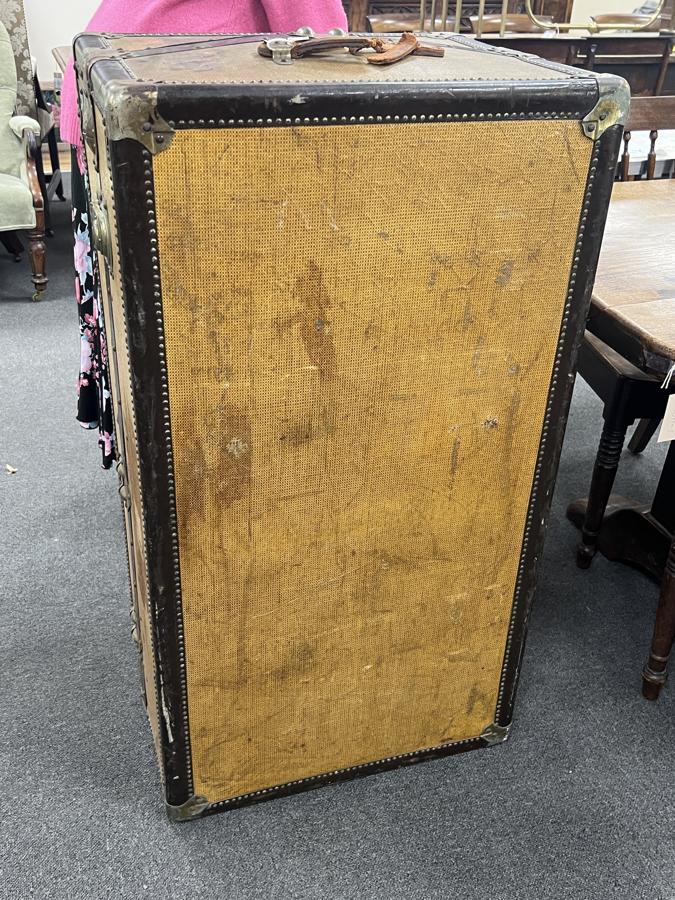 A vintage travelling trunk, (no key) width 103cm, depth 56cm, height 46cm